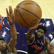 Giannis Antetokounmpo and Joel Embiid battle for the ball Tuesday night in Philly.